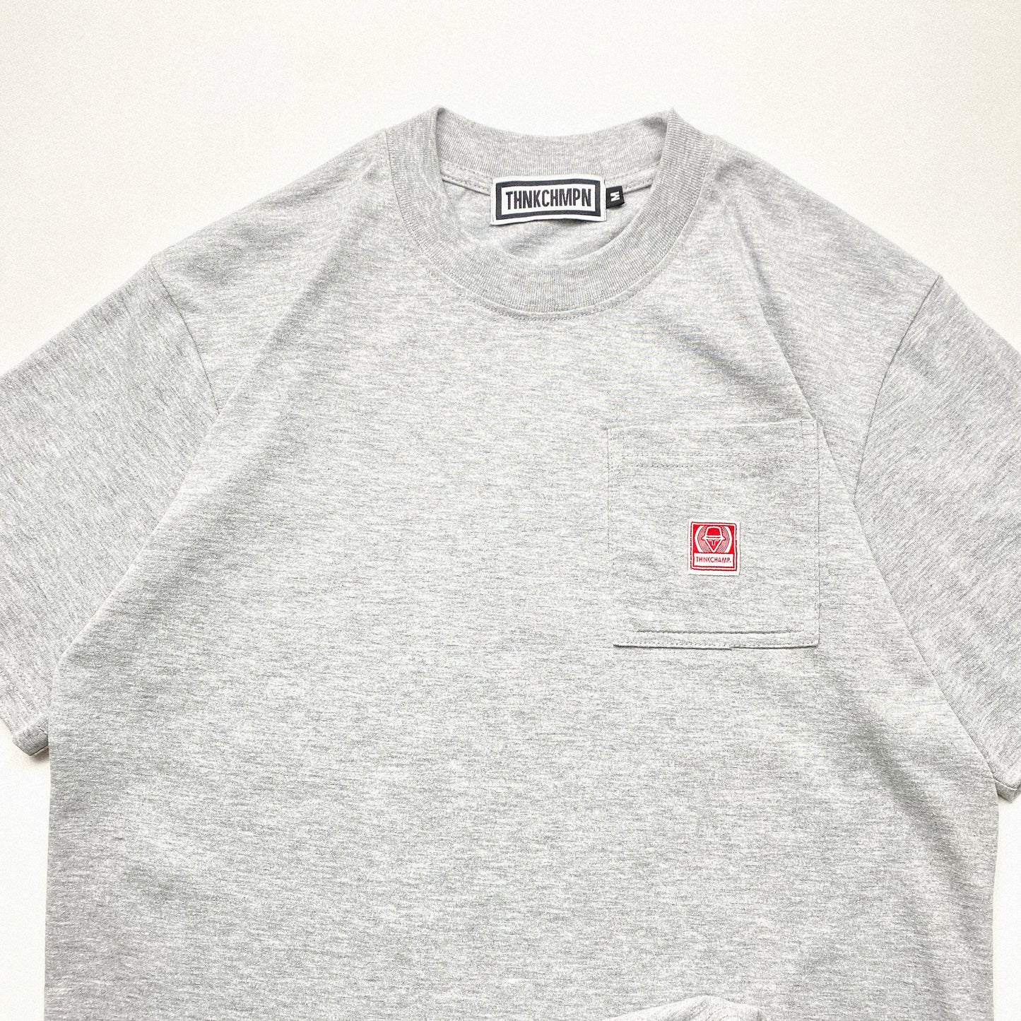THINK CHAMP | HEATHER GREY | SHORT SLEEVE POCKET TEE