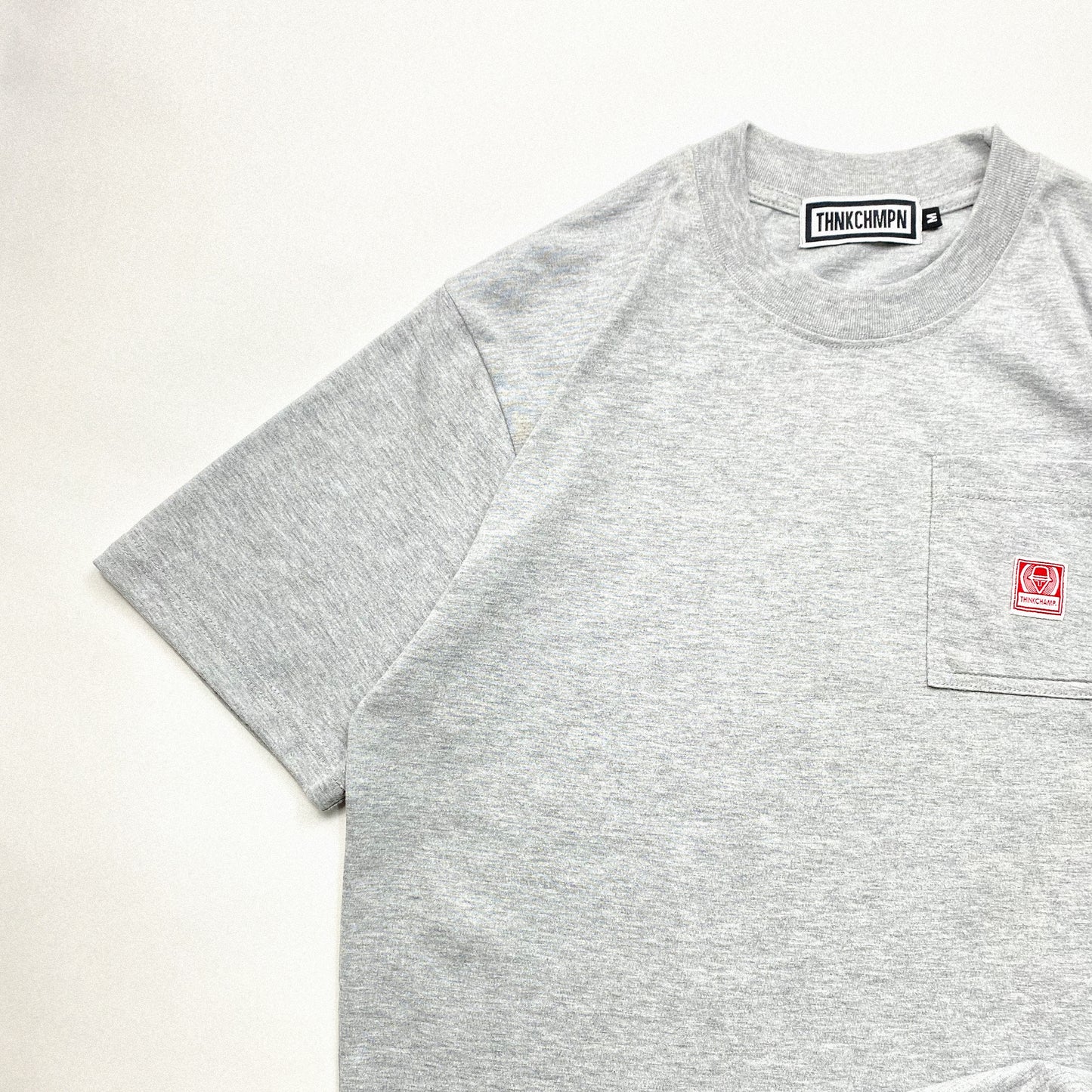 THINK CHAMP | HEATHER GREY | SHORT SLEEVE POCKET TEE